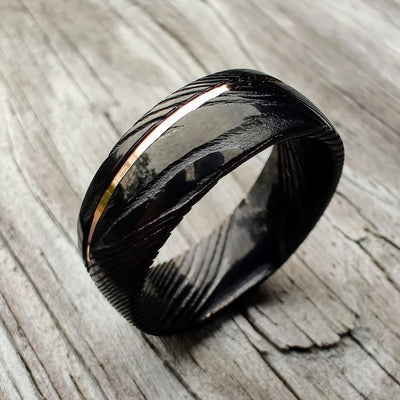 Polished Damascus Steel and Rose Gold Wedding Ring